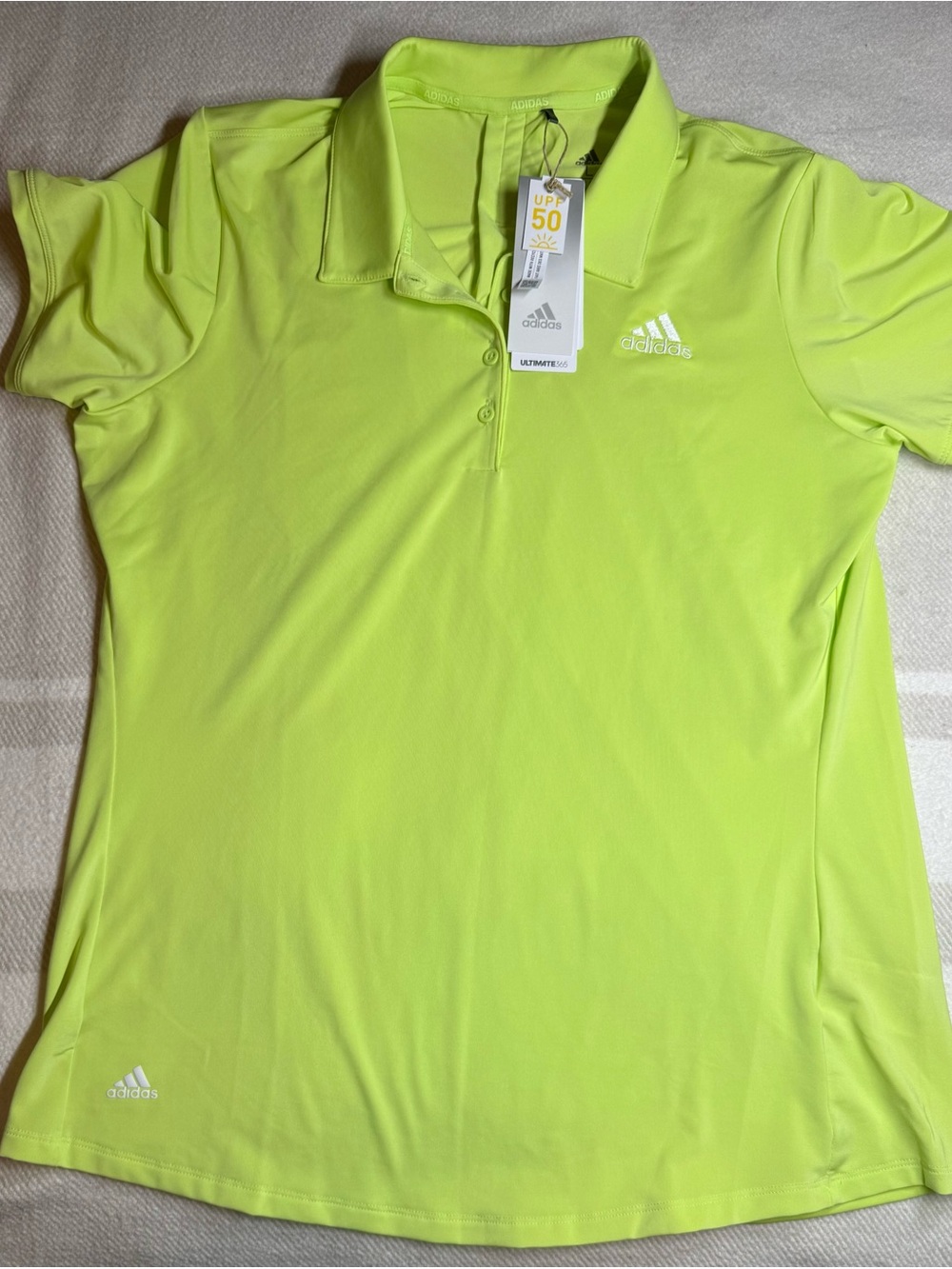 Ladies Adidas UJGA golf polo. NWT